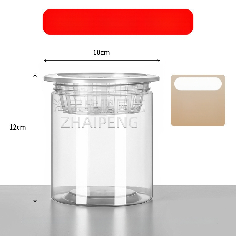 Caurspīdīgs plastmasas cilindrisks hydroponiskais pods sēklām un maziem augiem, stāvošs uz grīdas ar stādīšanas grozu, domāts mājas un dārza lietošanai