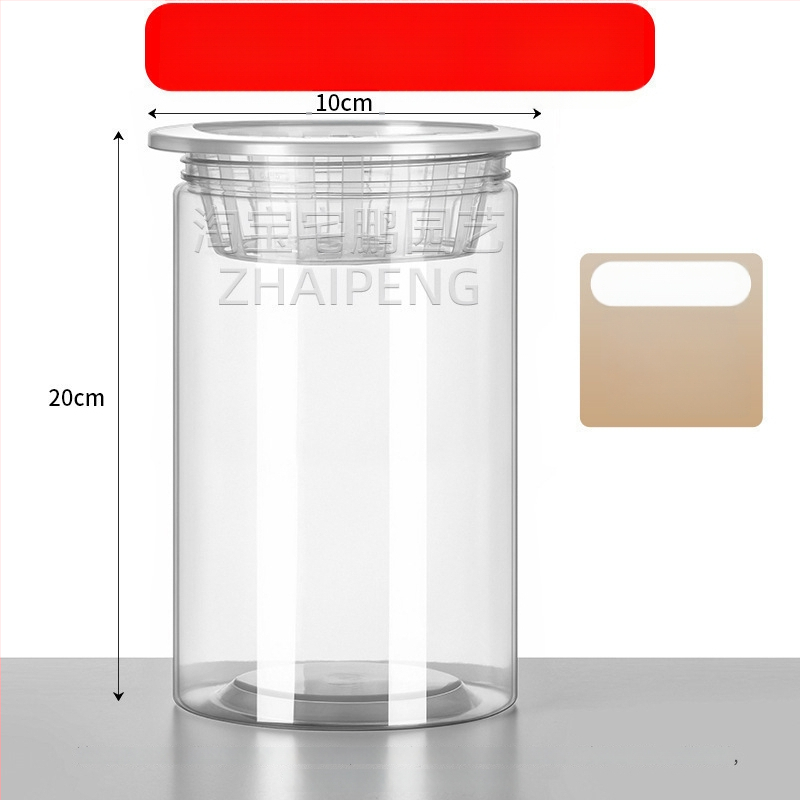 Caurspīdīgs plastmasas cilindrisks hydroponiskais pods sēklām un maziem augiem, stāvošs uz grīdas ar stādīšanas grozu, domāts mājas un dārza lietošanai