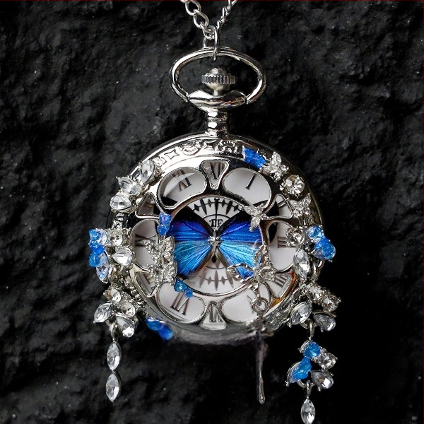 Liblika taskukell koos liikuva tegeliku liblika eksemplariga, ideaalne kingitus tüdrukutele ja sõbrannadele (Elektroniline mehhanism; veekindlus 35 m; silikoonkorpus; ümmargune kellapaneel; ABS klaas)