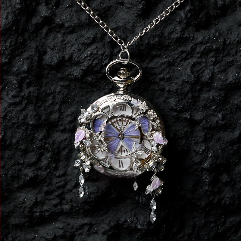 Liblika taskukell koos liikuva tegeliku liblika eksemplariga, ideaalne kingitus tüdrukutele ja sõbrannadele (Elektroniline mehhanism; veekindlus 35 m; silikoonkorpus; ümmargune kellapaneel; ABS klaas)