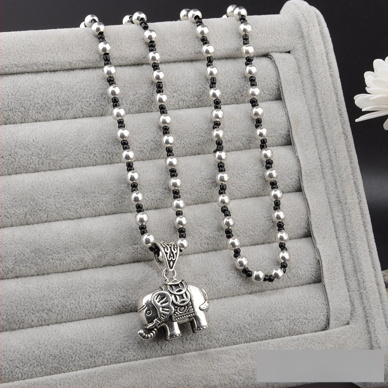 Lydinio puloverio grandinėlė, ilga karolė su kutiniu pakabuku, retro etno stilius