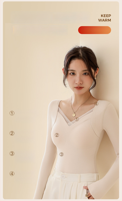 Moteriškas vilnos-silkės šiluminis viršus su V kaklu, įsiūtos krūties kaušės, tankus mezginys 251–300 g/m², pagrindinis audinys 80–90%, ilgos rankovės, kūno formavimas