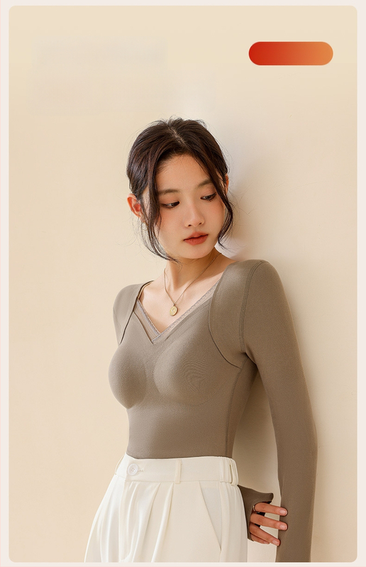 Moteriškas vilnos-silkės šiluminis viršus su V kaklu, įsiūtos krūties kaušės, tankus mezginys 251–300 g/m², pagrindinis audinys 80–90%, ilgos rankovės, kūno formavimas