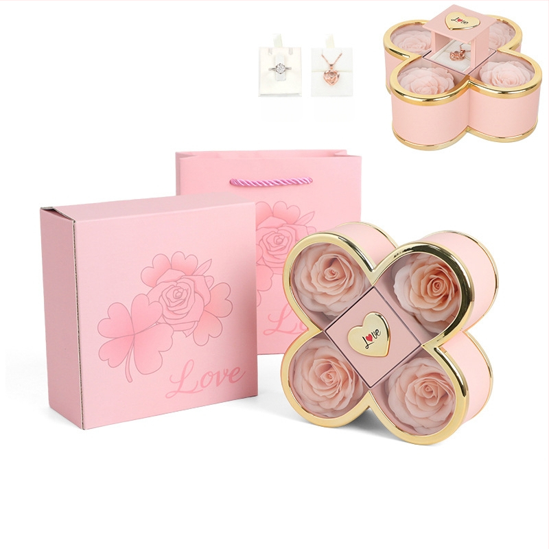 Kaklarotas dāvanu kastīte ar slēgtu četru lapu rozes mehānismu, plastmasas korpuss, kartona iepakojums, iekļauj dāvanu kastīti ar ziediem un somu