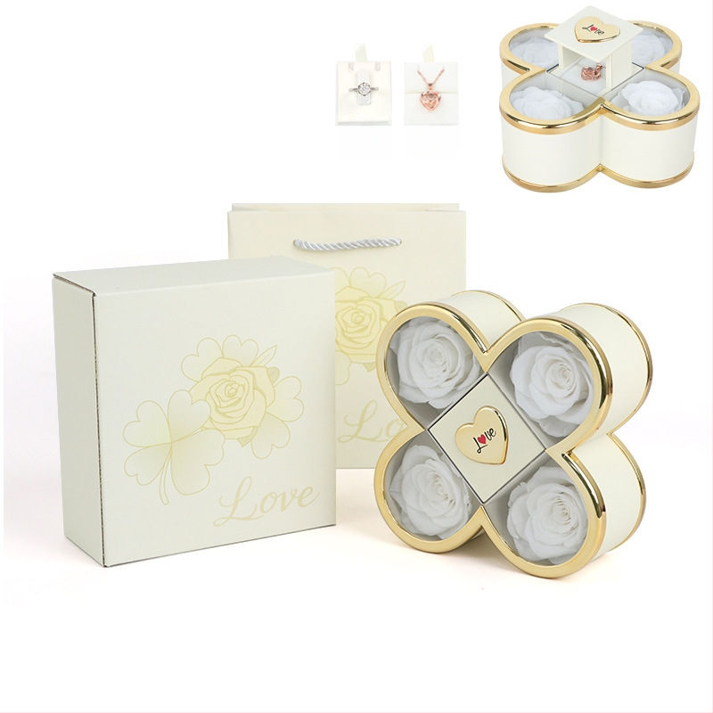 Kaklarotas dāvanu kastīte ar slēgtu četru lapu rozes mehānismu, plastmasas korpuss, kartona iepakojums, iekļauj dāvanu kastīti ar ziediem un somu