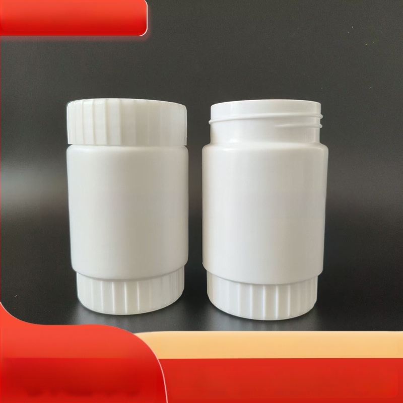 Plastikinė plačiai atidaryta buteliukui žemės ūkio chemijos pakuotei; skersmuo 34 mm; sienos storis 1 mm; apsaugos dangtelis nuo vagystės.