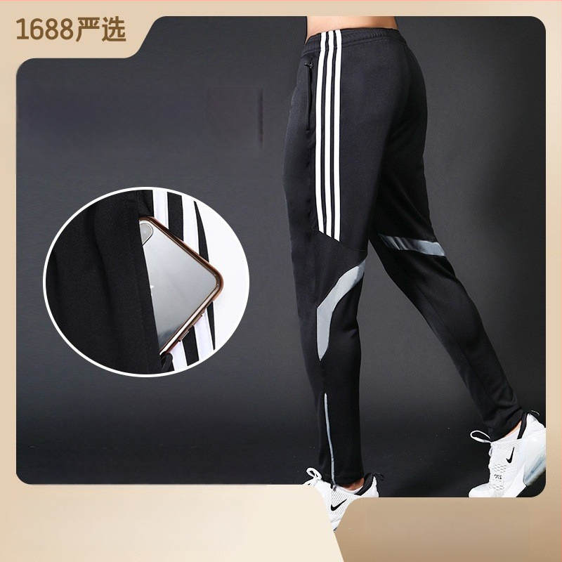 Ανδρικά αθλητικά παντελόνια με μέση στη μέση, εφαρμοστό κόψιμο, ύφασμα γρήγορο στέγνωμα και απομάκρυνση ιδρώτα, πλευρική ρίγα, μίξη πολυεστέρα 98% για τρέξιμο και προπόνηση.