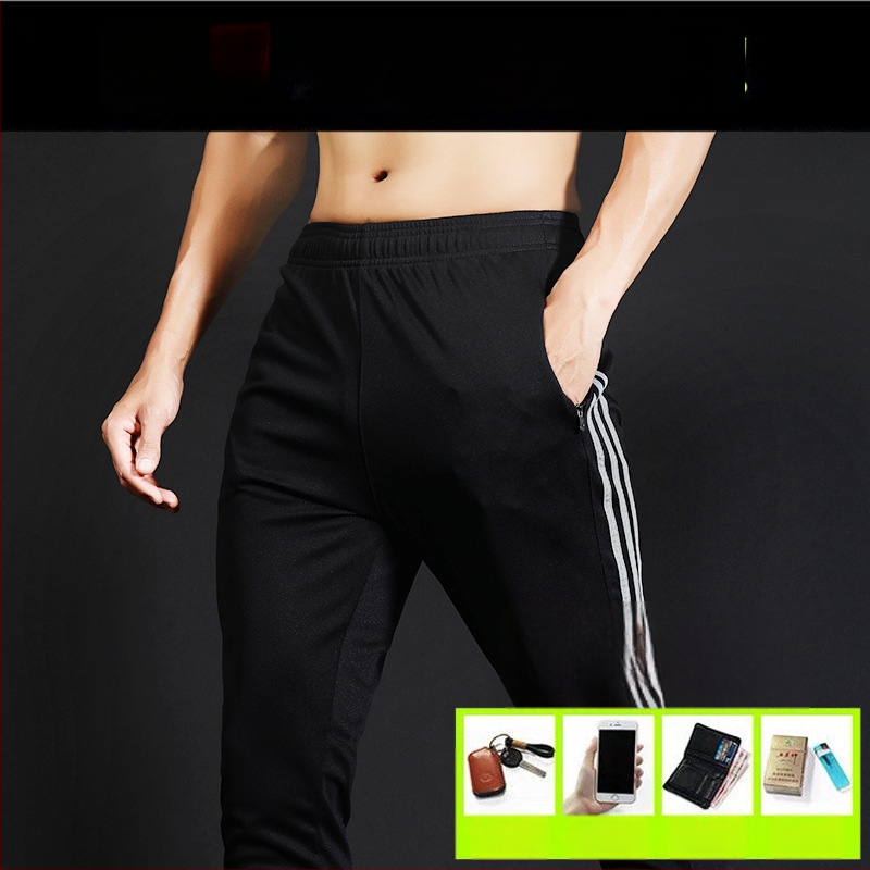 Ανδρικά αθλητικά παντελόνια με μέση στη μέση, εφαρμοστό κόψιμο, ύφασμα γρήγορο στέγνωμα και απομάκρυνση ιδρώτα, πλευρική ρίγα, μίξη πολυεστέρα 98% για τρέξιμο και προπόνηση.