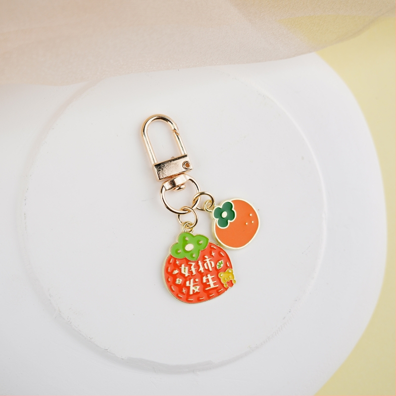 Fém kulcstartó medál – gyümölcs ihletésű szöveges dizájn és aranyos lányos karikatúra, táska kiegészítő, ajándék
