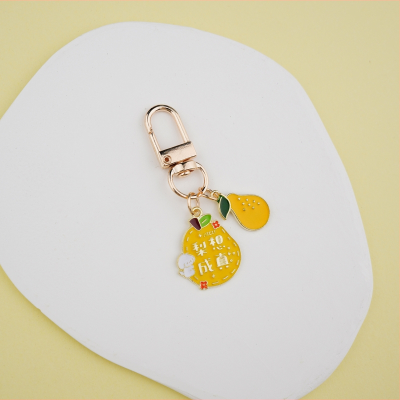 Fém kulcstartó medál – gyümölcs ihletésű szöveges dizájn és aranyos lányos karikatúra, táska kiegészítő, ajándék