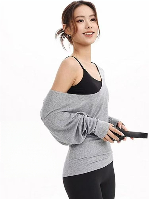 Ženski T-shirt s dugim rukavima i velikim U-izrezom, prekriva bokove, pogodna za sport, fitness i jogu; širok kroj, naglašava struk i vizualno sužava siluetu.