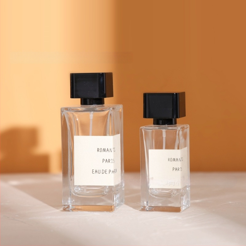 Sticluță de parfum din sticlă pătrată 50 ml/100 ml cu pulverizator, dop bayonet, pentru ambalarea parfumurilor și uleiurilor esențiale
