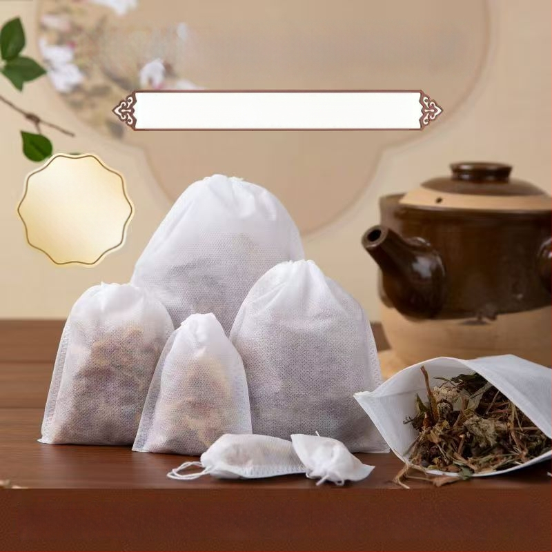 Pungi de ceai de unică folosință din material textil nețesut, cu șnur, pentru ceai, supe și decocturi