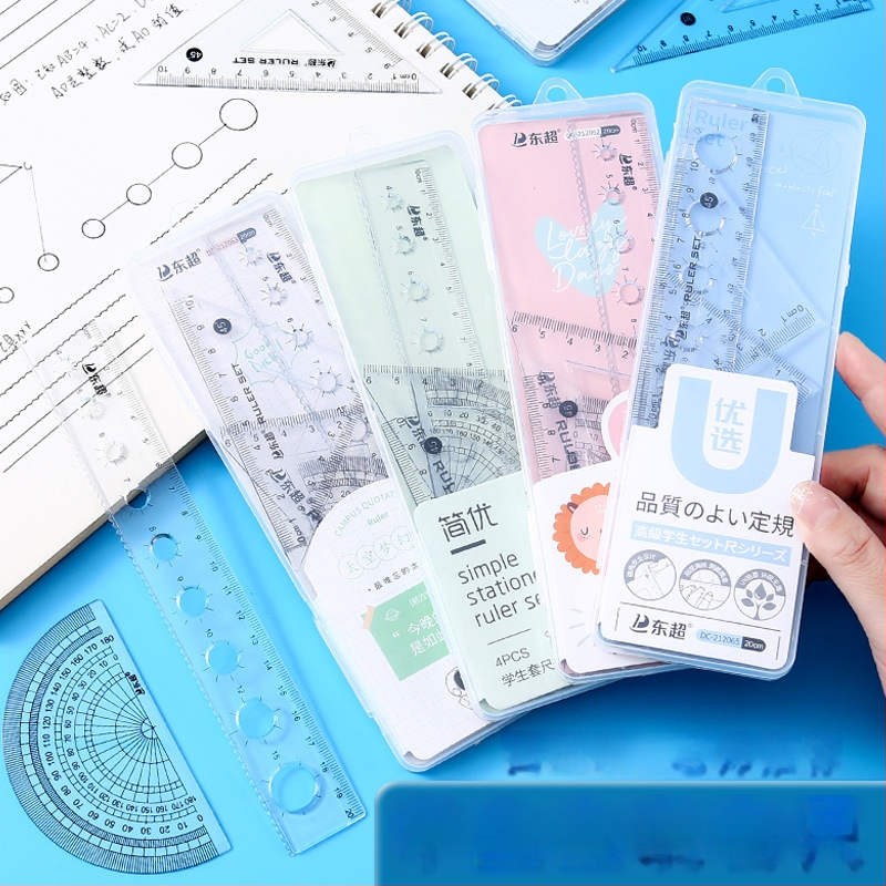 Set de rigle multifuncționale pentru elevi, în cutie transparentă, patru piese: riglă triunghiulară, riglă dreaptă și unghiometru, design animat