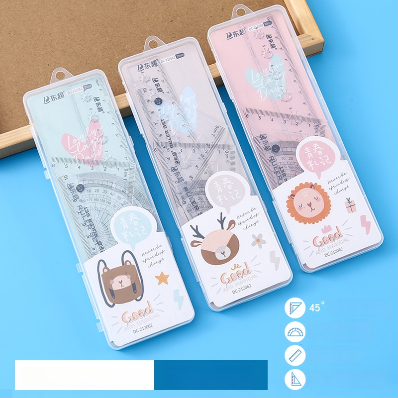 Set de rigle multifuncționale pentru elevi, în cutie transparentă, patru piese: riglă triunghiulară, riglă dreaptă și unghiometru, design animat