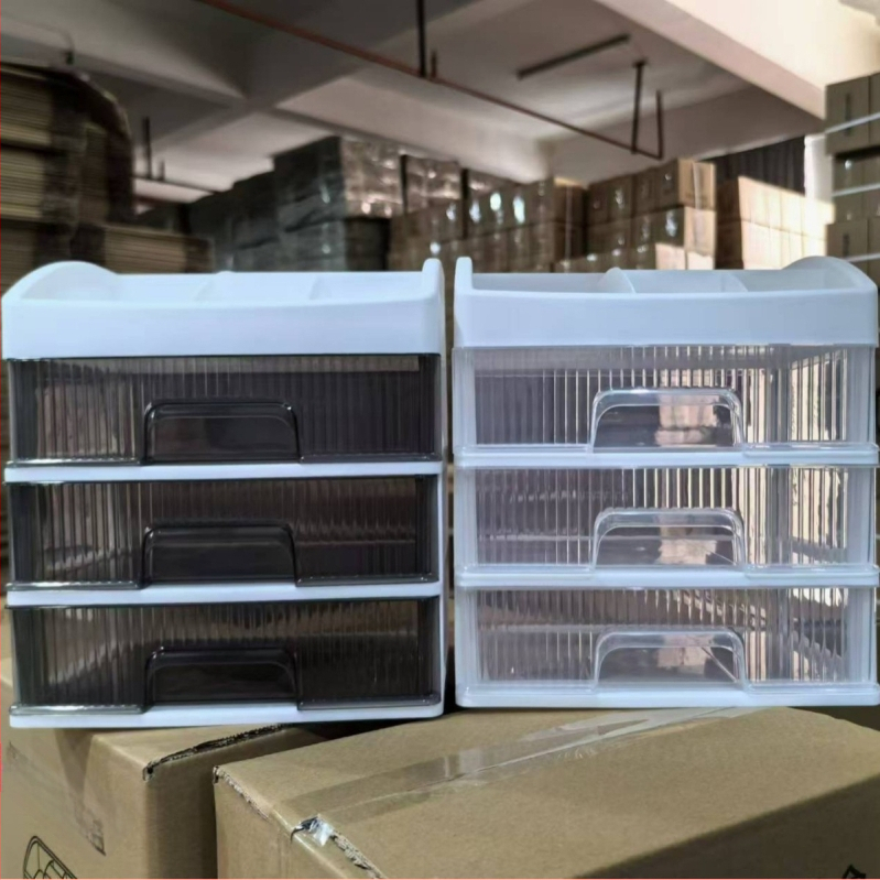 Asztali kozmetikai rendező fiókos, többrétegű tároló ékszerekhez, rúzsokhoz és bőrápolási termékekhez.