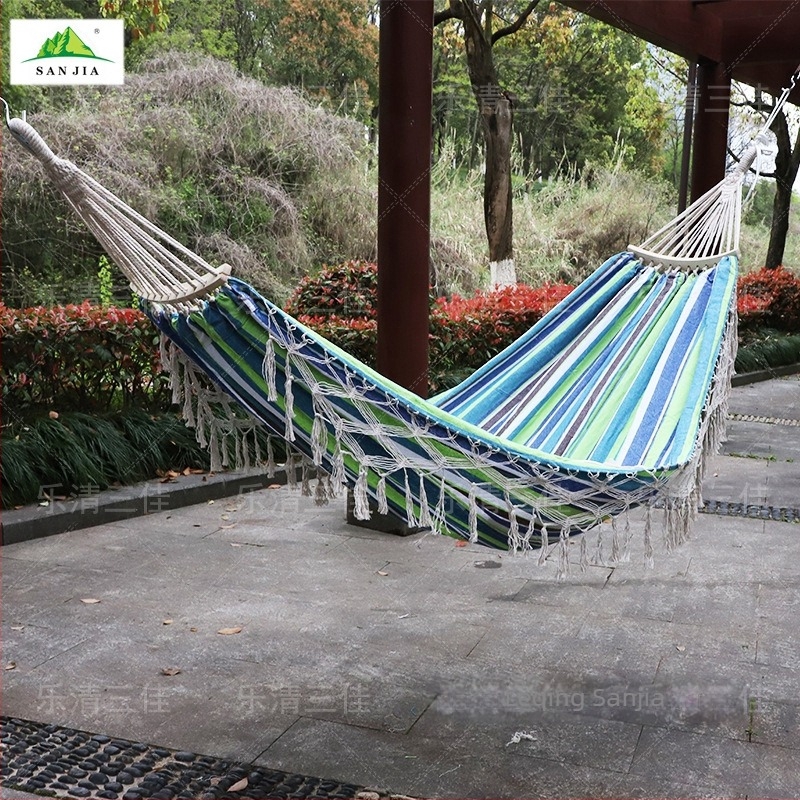 Ευρωπαϊκή και αμερικανική αιώρα με φούντα για εξωτερικούς χώρους, πτυσσόμενη χειροποίητη κούνια από καμβά, κάμπινγκ με καμπύλη λαβή, φορητή διπλή κρεμαστή καρέκλα χονδρικής