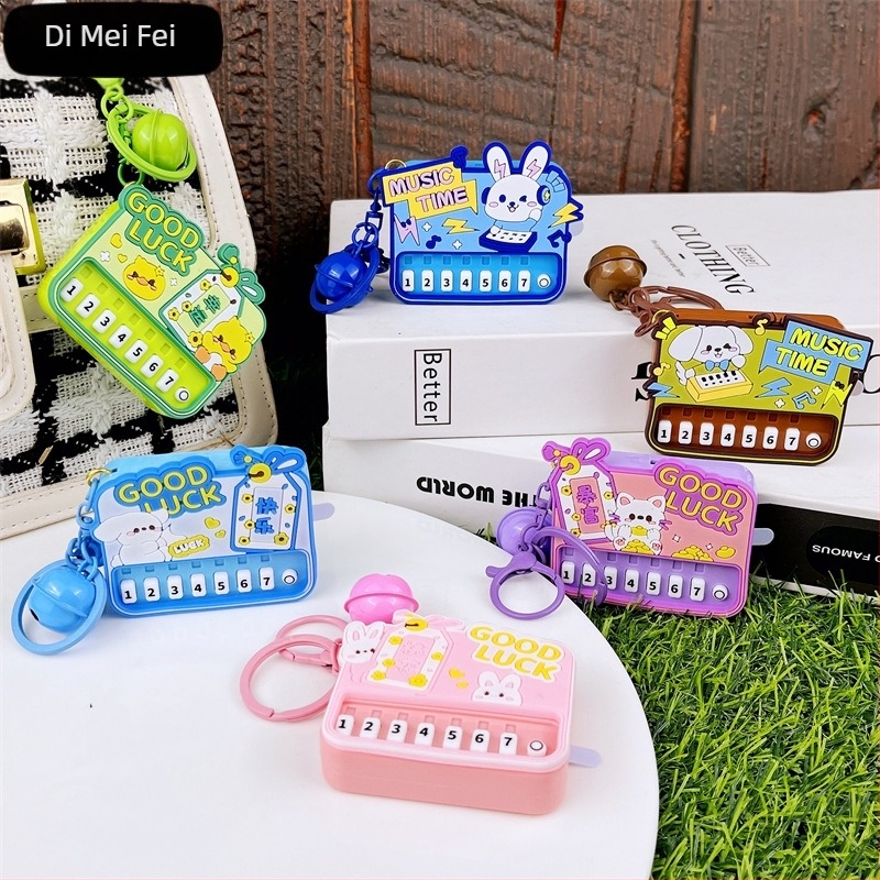 Μίνι πιάνο σε αλυσίδα κλειδιών με φως — εκπαιδευτικό φορητό μουσικό παιχνίδι από πλαστικό