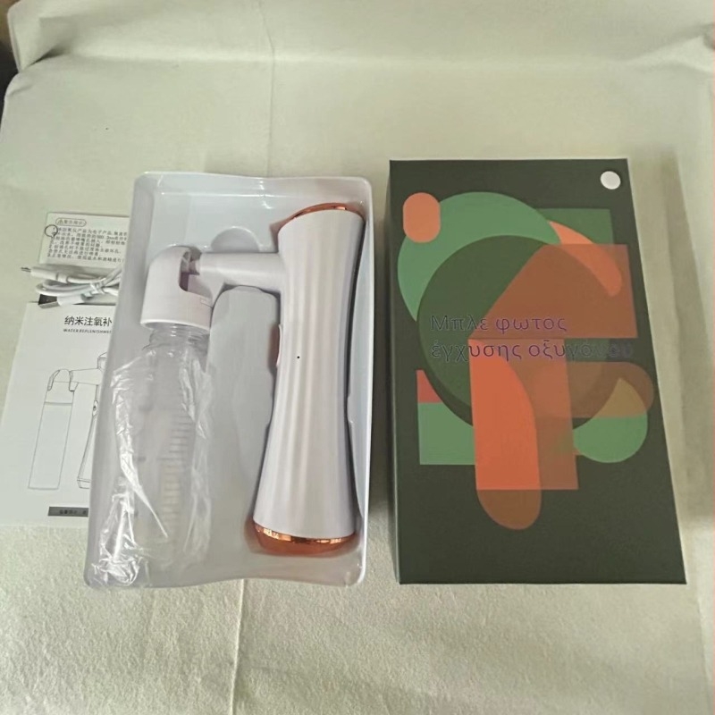 Χειροκίνητη συσκευή οξυγονοδόχου προσώπου με ψεκασμό μπλε φωτός και ενυδατική ουσία — 1 ρύθμιση, κρύος ψεκασμός, ABS περίβλημα, ενσωματωμένη μπαταρία 300–500 mAh, χρόνος ομίχλης ≤10 s