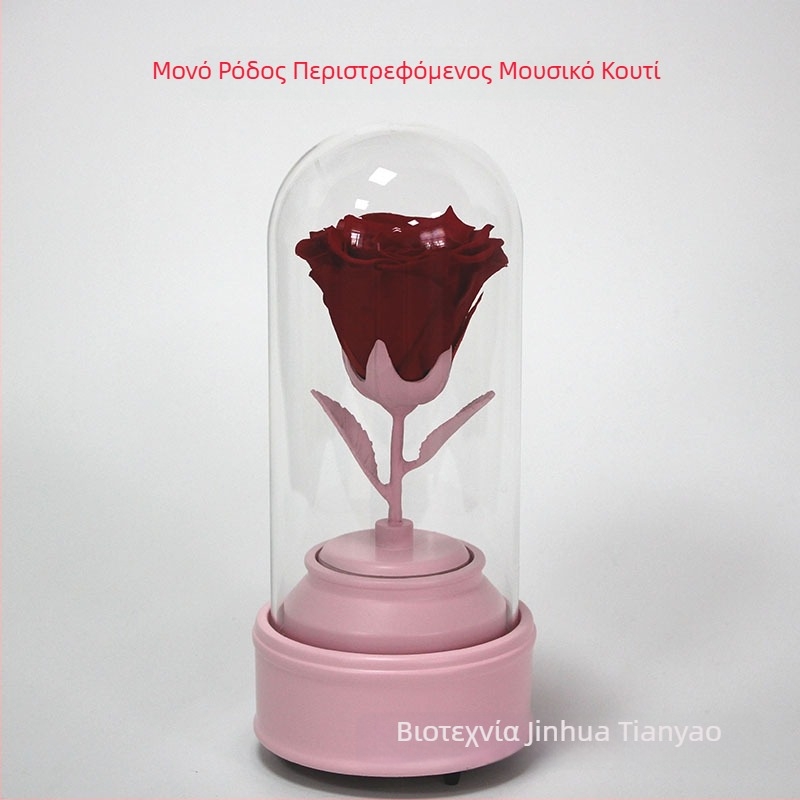 Κρυστάλλινη σφαίρα με περιστρεφόμενο μουσικό κουτί και ένα διατηρημένο τριαντάφυλλο