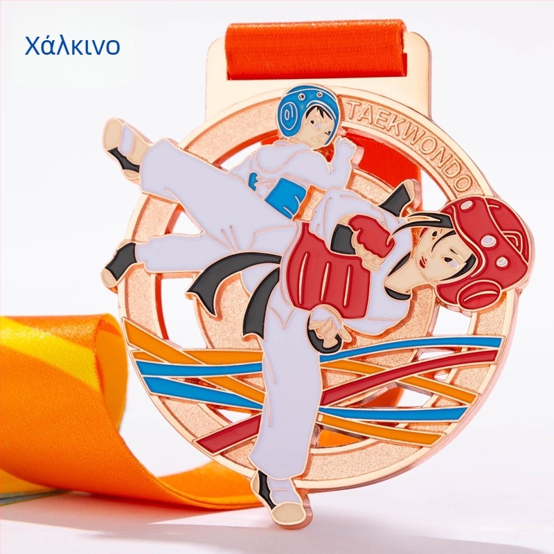 Μετάλλιο Ταεκβοντό, κράμα ψευδάργύρου με επίχρυσο επίχρισμα; εκτύπωση λογοτύπου περιλαμβάνεται; δυνατότητα εξατομίκευσης; κατάλληλο για ατομικό βραβείο; αποδεκτές ανάμικτες παρτίδες.