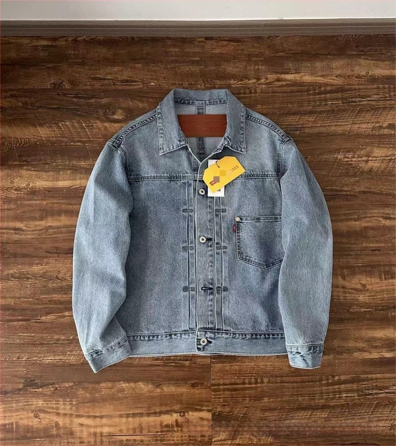 Πλυμένο τζιν μπουφάν με γιακά λάπελ, μονόμπορτο, κανονικό μήκος, πολλαπλά τσεπάκια