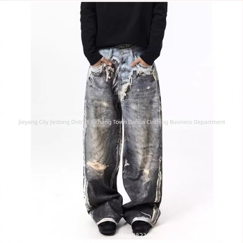 Γυναικείοι τζίν σε αμερικανικό streetwear στυλ, με υψηλή μέση, έντονο φθαρμένο εφέ και πλύσιμο με λάσπη, σχισμές, εφέ ψευδούς διπλού σχεδίου, χαλαρή γραμμή και μακριά ίσια παντελόνια.