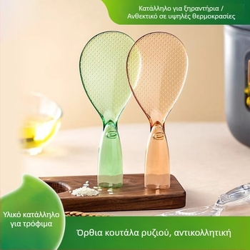 Διάφανη αντικολλητική κουτάλα σερβιρίσματος ρυζιού με χαριτωμένο σχέδιο μικρού τέρατος, σε όρθια θέση
