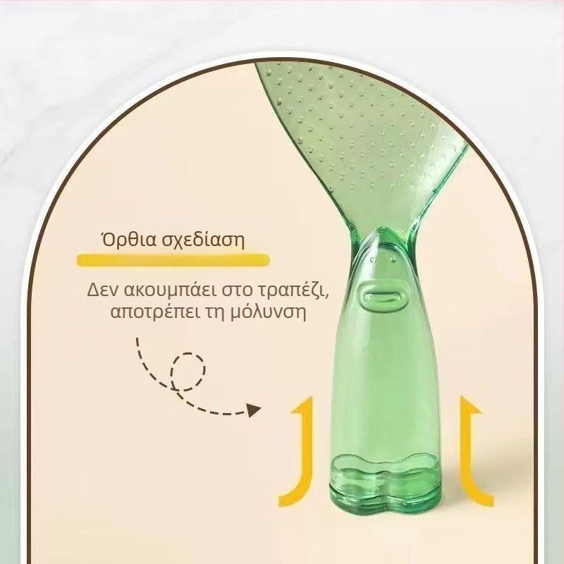 Διάφανη αντικολλητική κουτάλα σερβιρίσματος ρυζιού με χαριτωμένο σχέδιο μικρού τέρατος, σε όρθια θέση