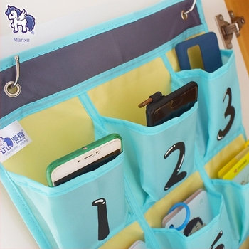 Zidni organizator za telefon i ostale predmete; 16 pretinaca; materijal: netkani materijal; model MX-0010; višestruka namjena
