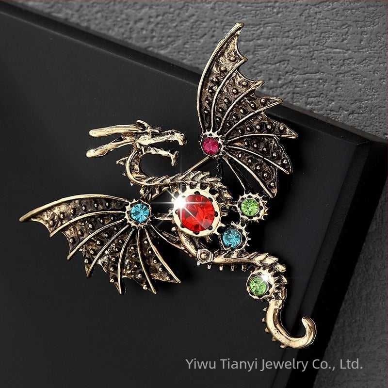 Broš iz legure, sa dijamantima, motiv letaćeg zmaja u crtanom stilu, unisex, modni dodatak
