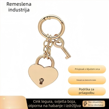 Ključni lanac s metalnim zatvaračem u obliku srca i petokrake zvijezde, s oprugom, za torbe