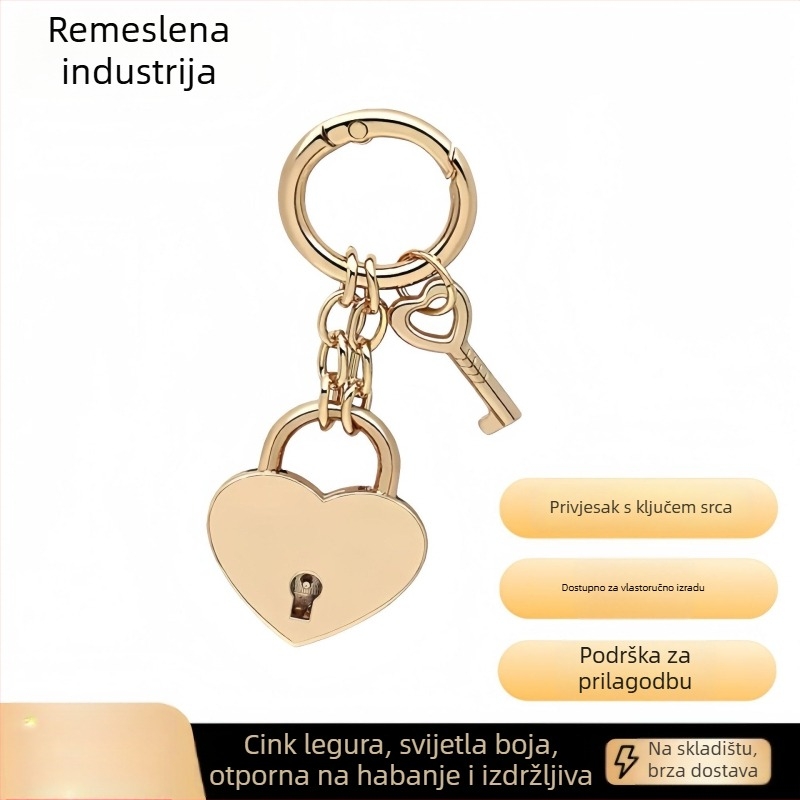 Ključni lanac s metalnim zatvaračem u obliku srca i petokrake zvijezde, s oprugom, za torbe