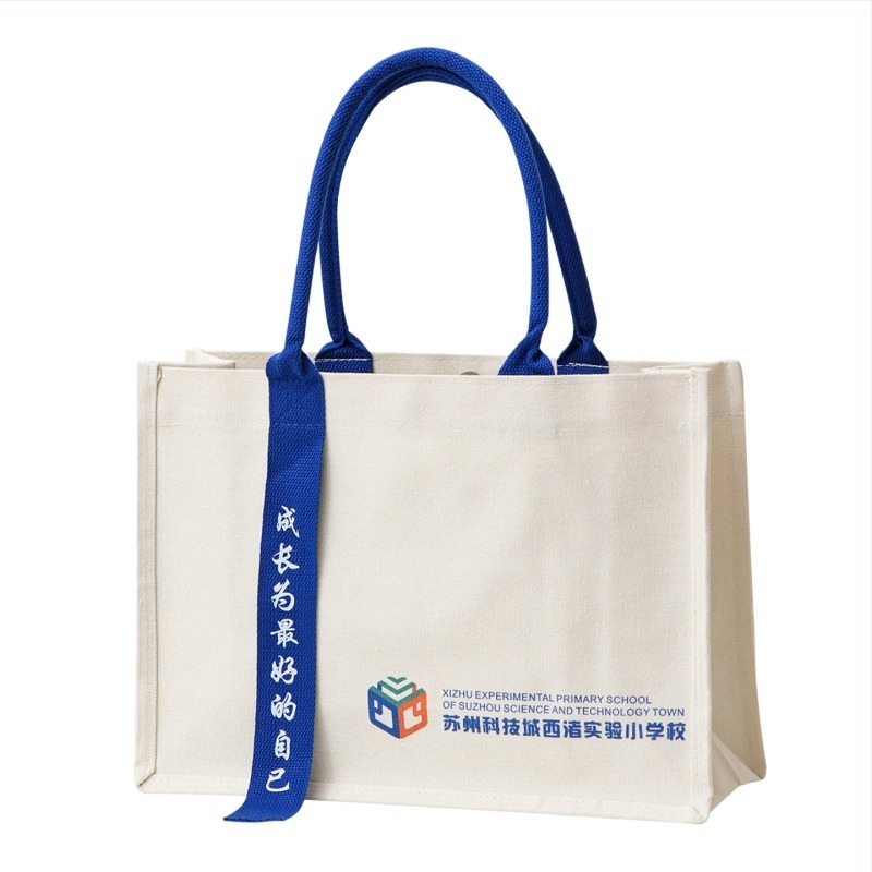 Laminirana platnena tote torba s vlastitim logotipom; pogodna za izložbe i školske poklone; različiti načini nošenja; metode tiska: toplinski prijenos, vez, sitotisak