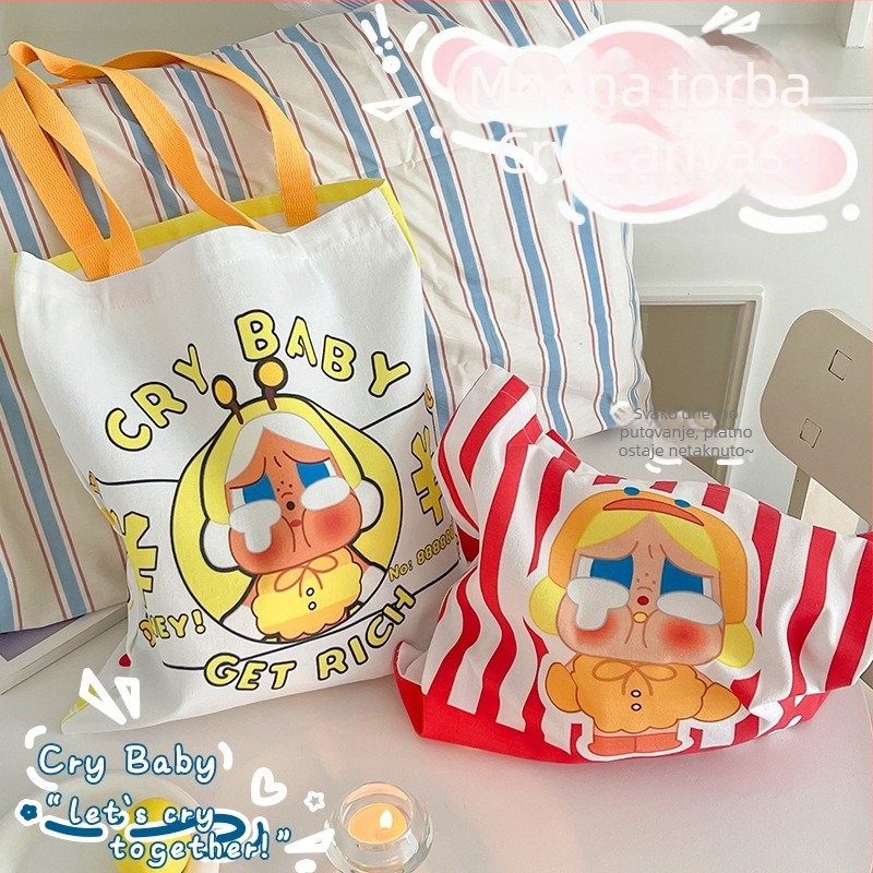 Platnena bucket torba s motivom plačljivog djeteta, velika kapaciteta za svakodnevno nošenje preko ramena, otvor s otvorom usta, dvostruka naramenica, unutarnji džepovi za laptop, telefon i dokumente.