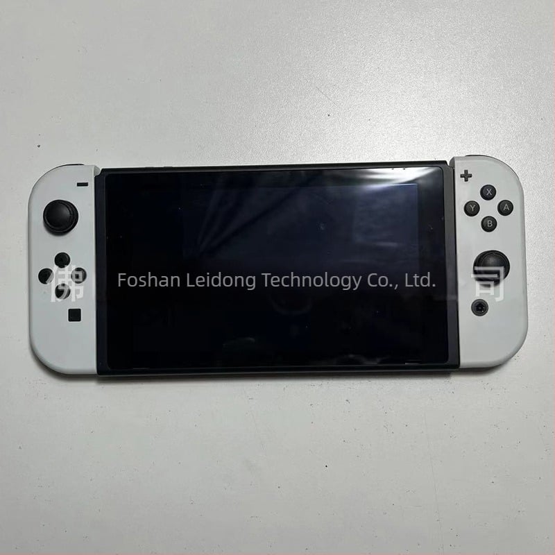 Nintendo Switch prikazni model NS s kontrolerom – rekvizit za izlog (Model:NS; Paket: domaćinska jedinica, 1 ručni kontroler, 1 par; Težina: 400 g; Verzija igre: paperback)