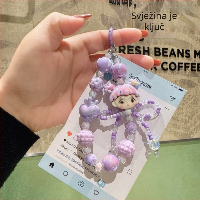 Karikatura-akrilni privjesak za telefon s kristalnom mašnicom i nizu od perlica (Brand: Hibiscus Jewelry; Materijal: Akril; Obrada: Elektropaljivanje; Vzor: Zvjezdice/Sunce i Mjesec/Nebesa; Stil: Crtani, Dodaci za telefon)