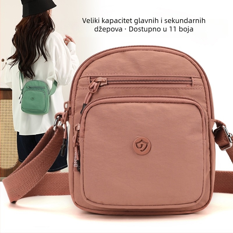 Najlonska crossbody torba s vertikalnim kvadratnim oblikom, zatvaračem, džepom za mobitel i unutarnjim patch džepom.