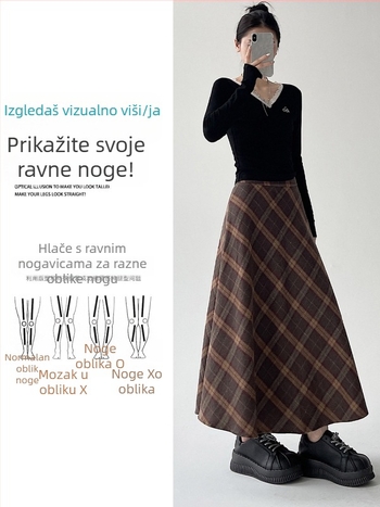 Srednje duljine suknja kišobranog kroja, visokim strukom, prugasti ili karirani uzorak; materijal: poliester s vunenim udjelom i manje od 30% pamuka; mikroelastičnost; jesen-zima 2025