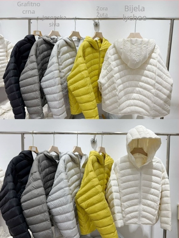 Jakna od perja, slobodan kroj, debela, srednja duljina 65–80 cm, zatvarač, sadržaj perja 86–90%