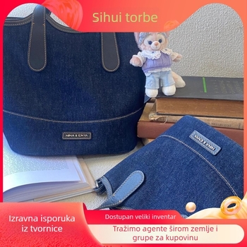 Bucket torba - urban stil jednostavnosti; Materijal: Oxford tkanina; Oblik: bucket tip; Otvaranje: magnetska kopča; Podstava: platno