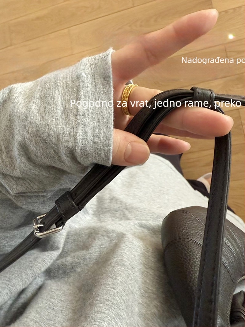 Kožna mini torbica u obliku kroasana, s držačem ključeva, držačem kartica i novčanikom, nosiva preko ramena