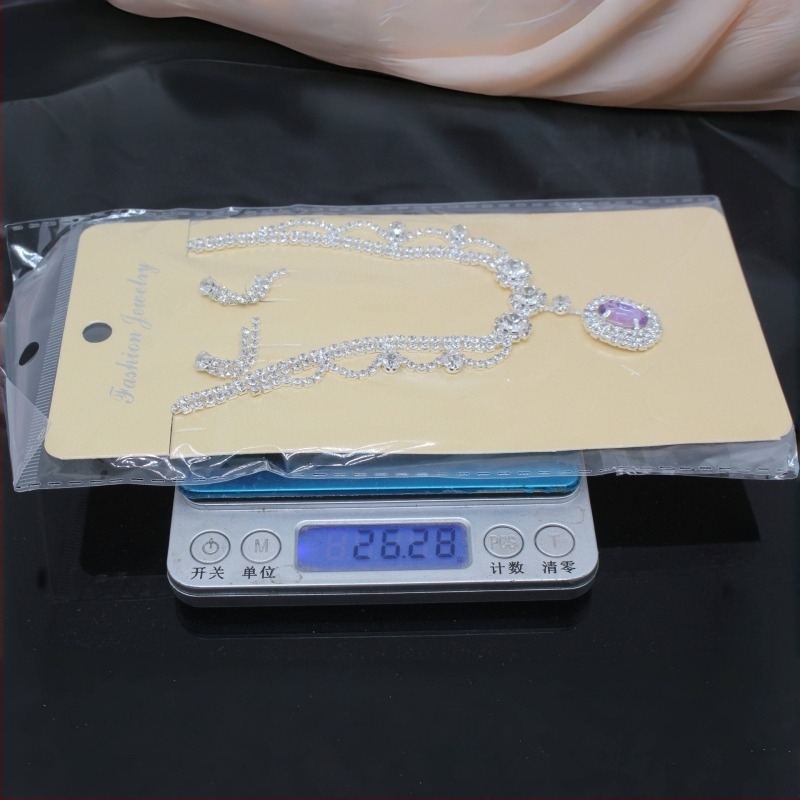 Dva dijela set nakita: ogrlica i naušnice; Materijal: bakrena legura; Privjesak materijal: kristal; Lanac: standardni lanac; Oblik: geometrijski; Marka: tecan