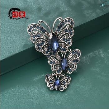 Broš s motivom leptira i insektoidnim stilom, s dijamantno-krištalnim postavom (Materijal: Zlaktina; Stil: Insekta; Obrada: Dijamant; Funkcija: Višestruka; Vrsta: Broš)