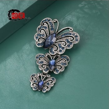 Broš s motivom leptira i insektoidnim stilom, s dijamantno-krištalnim postavom (Materijal: Zlaktina; Stil: Insekta; Obrada: Dijamant; Funkcija: Višestruka; Vrsta: Broš)