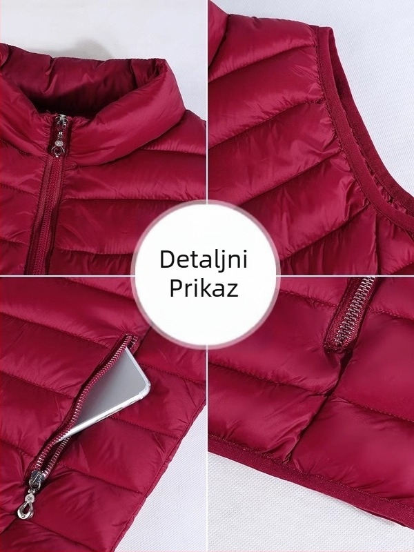 Ženska vesta od poliester materijala, uski kroj, stojeći ovratnik, zatvarač, punjenje poliester-pamuk