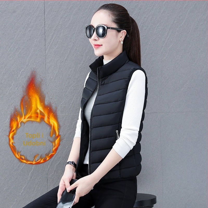 Ženska vesta od poliester materijala, uski kroj, stojeći ovratnik, zatvarač, punjenje poliester-pamuk