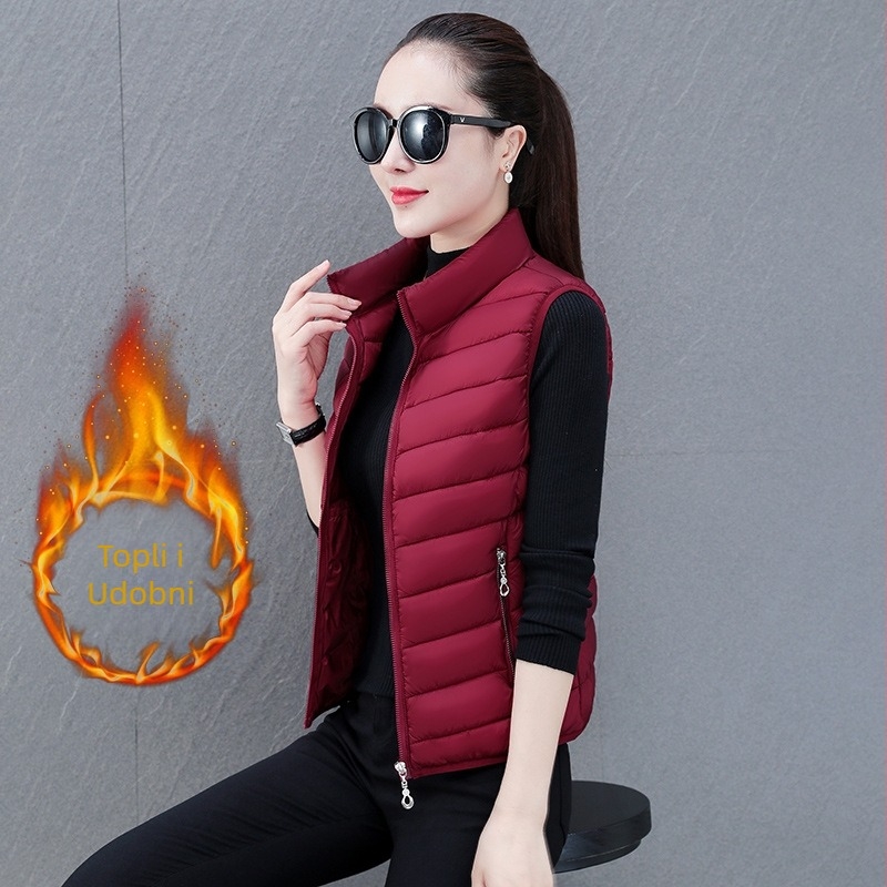 Ženska vesta od poliester materijala, uski kroj, stojeći ovratnik, zatvarač, punjenje poliester-pamuk