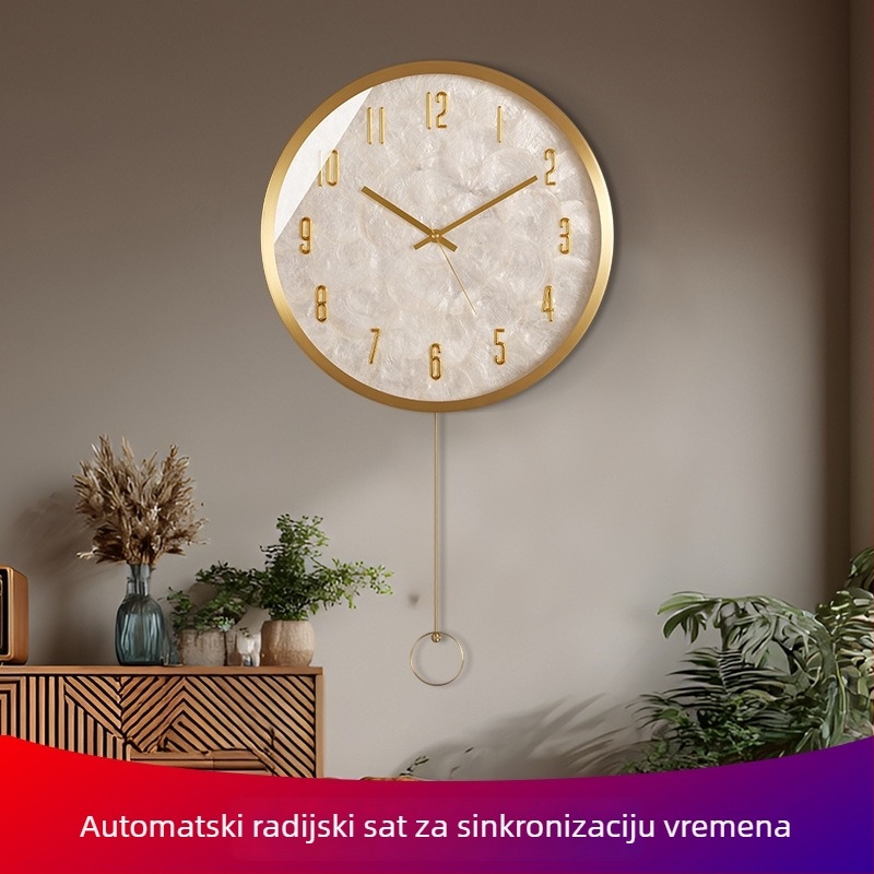 Zidni sat — okruglog oblika, mjedeno kućište, brojčanik od školjke, kvarcni mehanizam, napajan baterijom