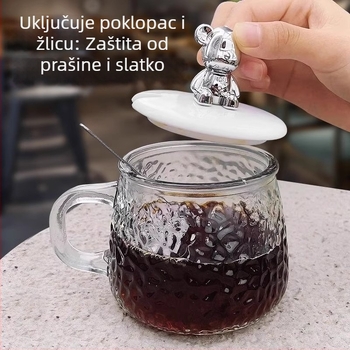 Staklena šalica za kavu s udarnom teksturom, s držakom i poklopcem — kružni oblik, moderni minimalistički stil